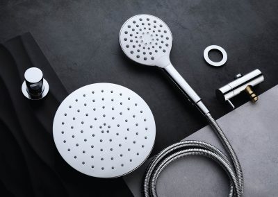 Flat lay of silver shower heads and fixtures by Watersino.